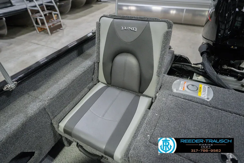 Slide: The Image of 2026 Lund 1675 Adventure Sport boat seat in a showroom setting. - 43