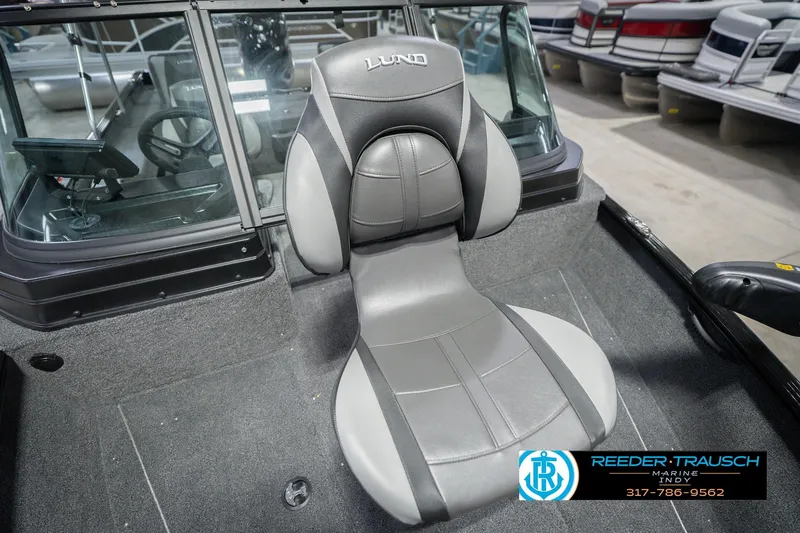 Slide: The Image of 2026 Lund 1675 Adventure Sport boat interior with gray seating and steering console. - 44