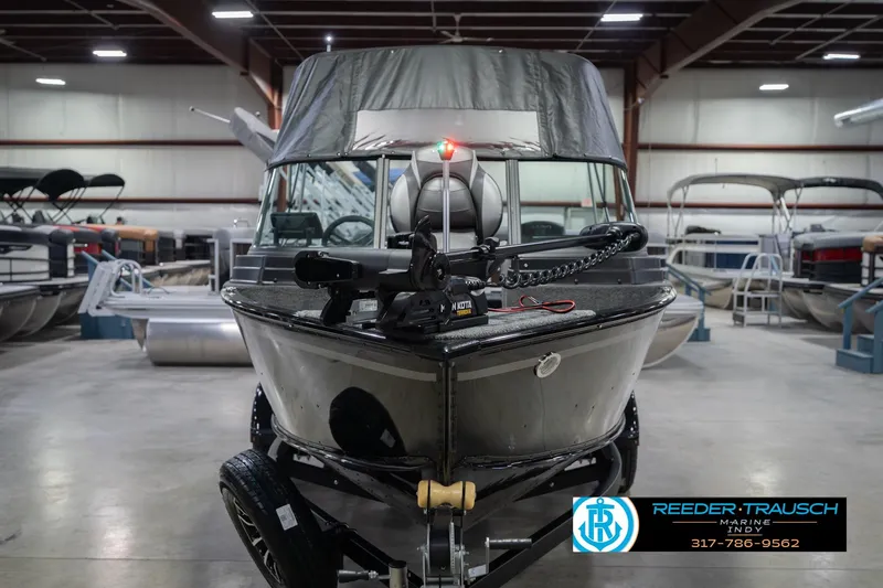 Slide: The Image of 2026 Lund 1675 Adventure Sport boat in showroom, featuring sleek design and advanced equipment. - 5