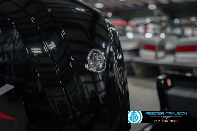 Slide: The Image of 2026 Lund 1675 Adventure Sport boat detail in showroom with logo and contact information. - 50