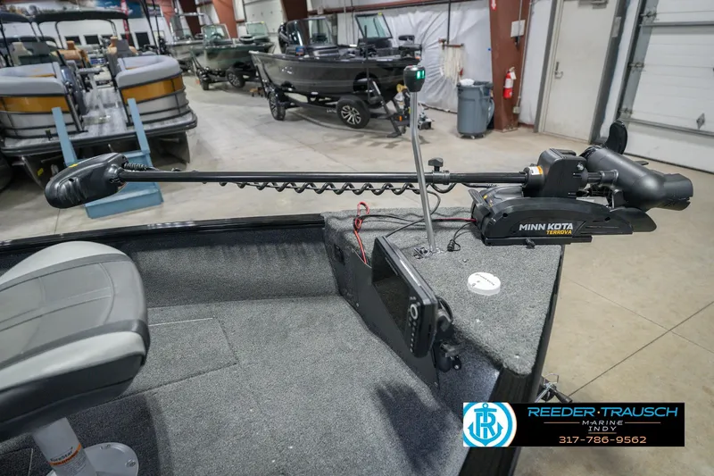 Slide: The Image of 2026 Lund 1675 Adventure Sport boat with Minn Kota Terrova trolling motor in showroom. - 52