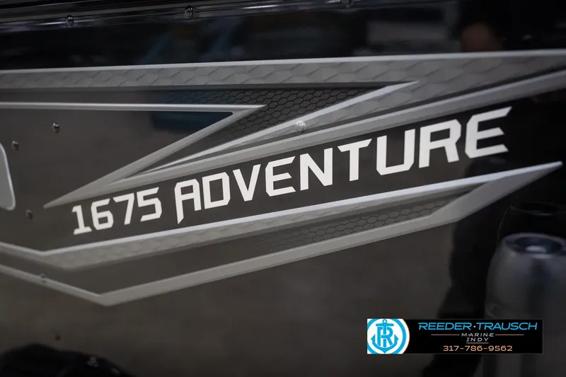 Slide: The Image of 2026 Lund 1675 Adventure Sport boat logo with sleek design and branding. - 57