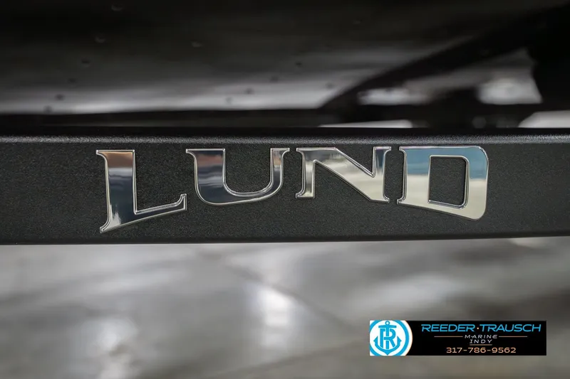 Slide: The Image of Close-up of Lund logo on 2026 Lund 1675 Adventure Sport boat. - 60