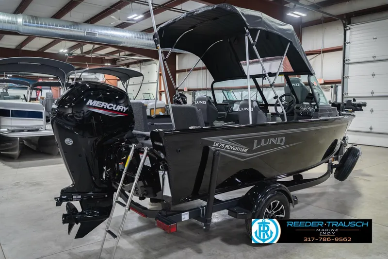 Slide: The Image of 2026 Lund 1675 Adventure Sport boat with Mercury engine in showroom. - 8