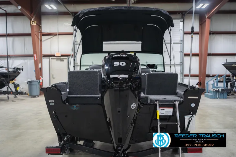 Slide: The Image of 2026 Lund 1675 Adventure Sport boat with Mercury 90 engine in showroom. - 9