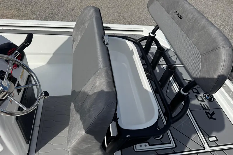 Slide: The Image of Avid 21 Recon ST 2026 boat interior with steering wheel and seating area. - 16