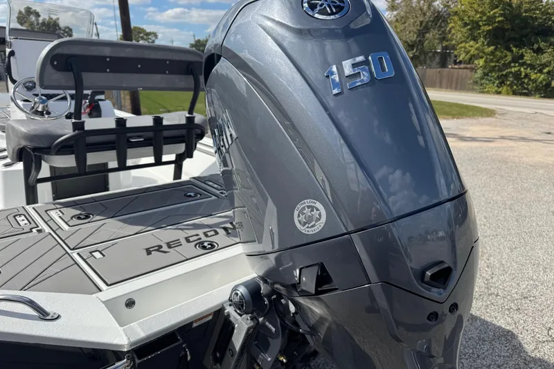 Slide: The Image of Avid 21 Recon ST 2026 boat with a 150 horsepower engine, featuring sleek design and seating. - 18