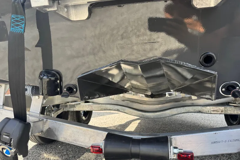 Slide: The Image of Avid 21 Recon ST 2026 boat hull on trailer, showcasing underbody design. - 19