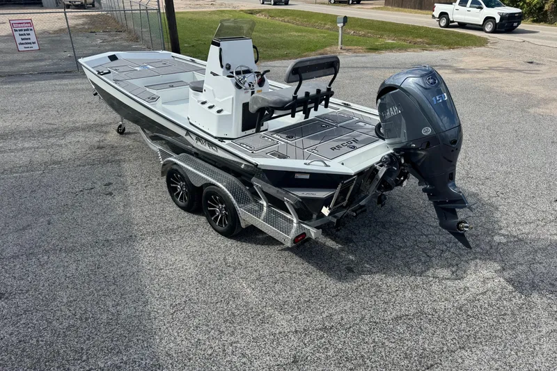 Slide: The Image of 2026 Avid 21 Recon ST boat on trailer with Yamaha 150 outboard motor. - 2