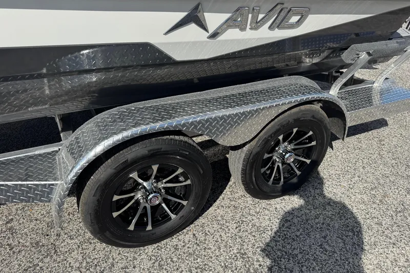 Slide: The Image of Avid 21 Recon ST 2026 boat trailer with dual black alloy wheels. - 23
