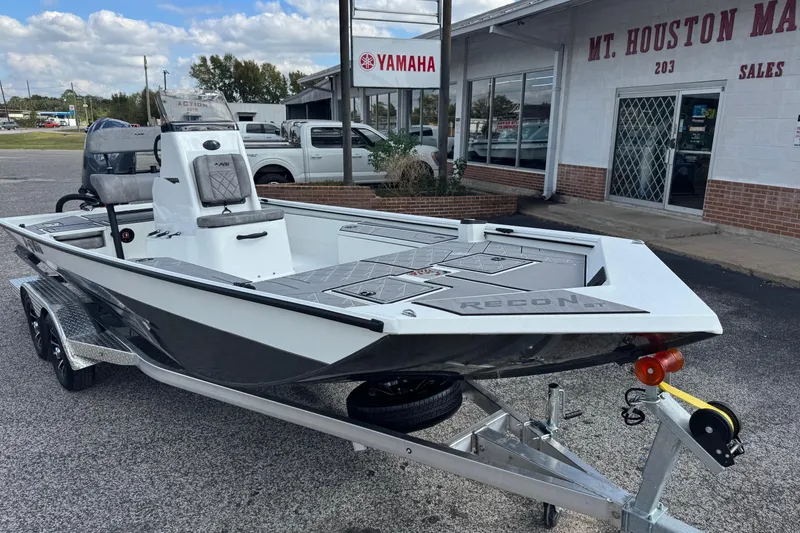 Slide: The Image of 2026 Avid 21 Recon ST boat on trailer outside dealership, showcasing sleek design. - 3