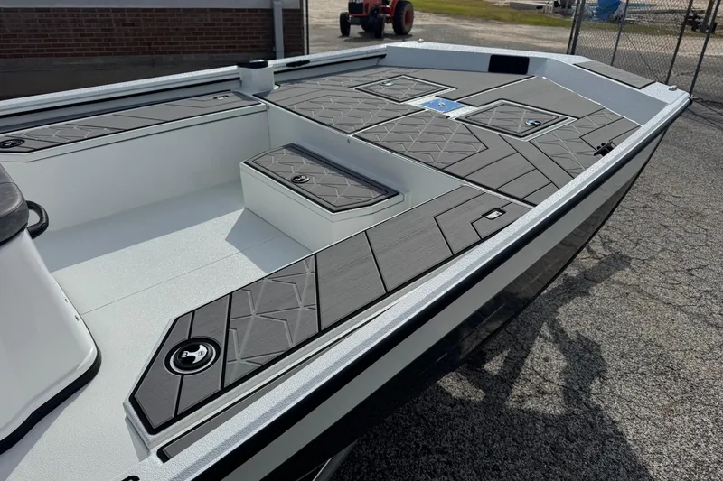 Slide: The Image of 2026 Avid 21 Recon ST boat deck with sleek, modern design and storage compartments. - 8