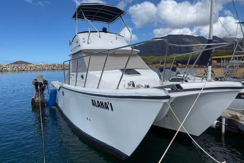 Slide: The Image of 2007 Baha Cruisers 340 King Cat docked in a scenic marina. - 4