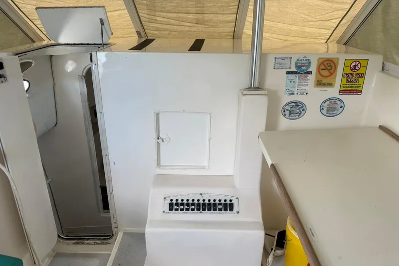 Slide: The Image of 2007 Baha Cruisers 340 King Cat interior with control panel and safety notices. - 7