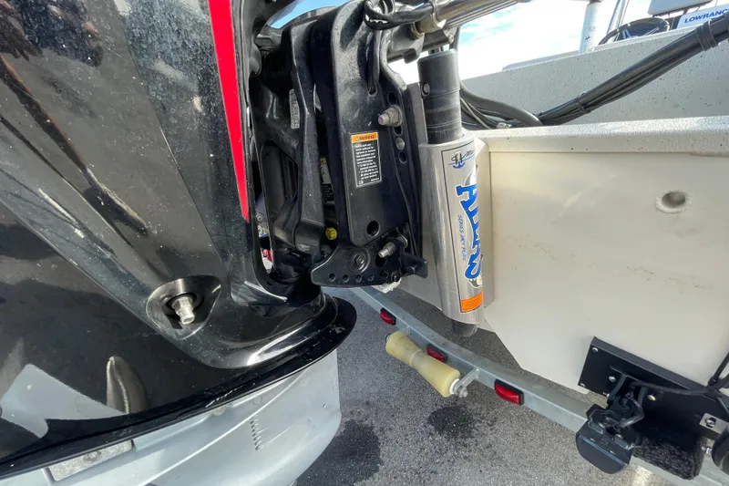 Slide: The Image of 2023 Ranger RB190 boat motor and hydraulic system close-up on trailer. - 11