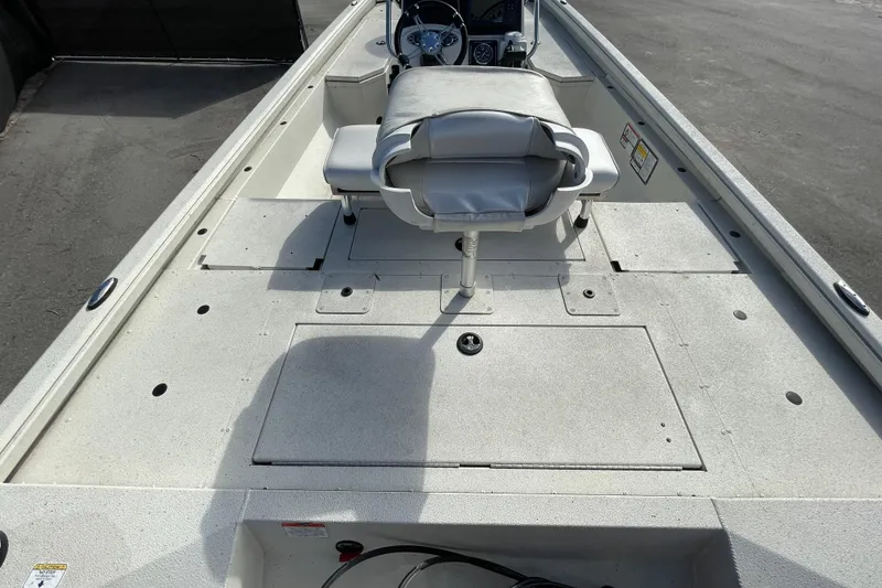 Slide: The Image of 2023 Ranger RB190 boat interior with seating and storage compartments. - 15