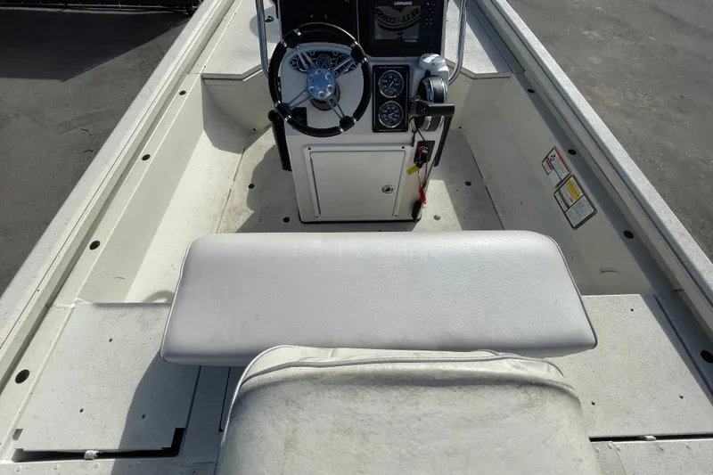 Slide: The Image of 2023 Ranger RB190 boat interior with steering console and seating. - 19