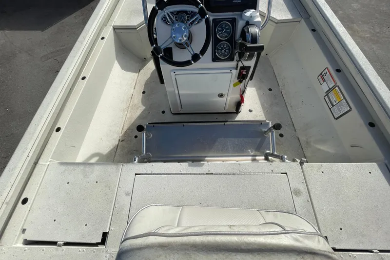 Slide: The Image of 2023 Ranger RB190 boat interior with steering console and seating area. - 20