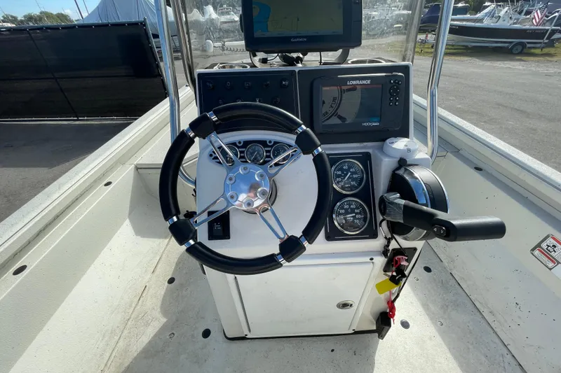 Slide: The Image of 2023 Ranger RB190 boat console with steering wheel, gauges, and navigation equipment. - 22