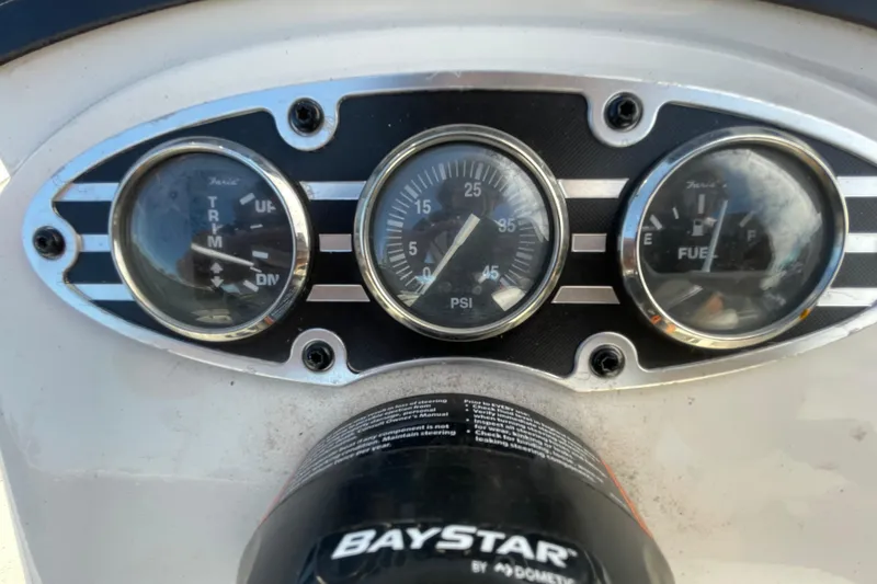 Slide: The Image of Dashboard of 2023 Ranger RB190 boat with gauges and BayStar steering system. - 24