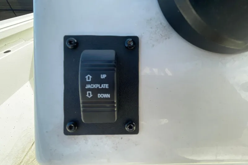 Slide: The Image of 2023 Ranger RB190 jackplate control switch on boat console. - 28