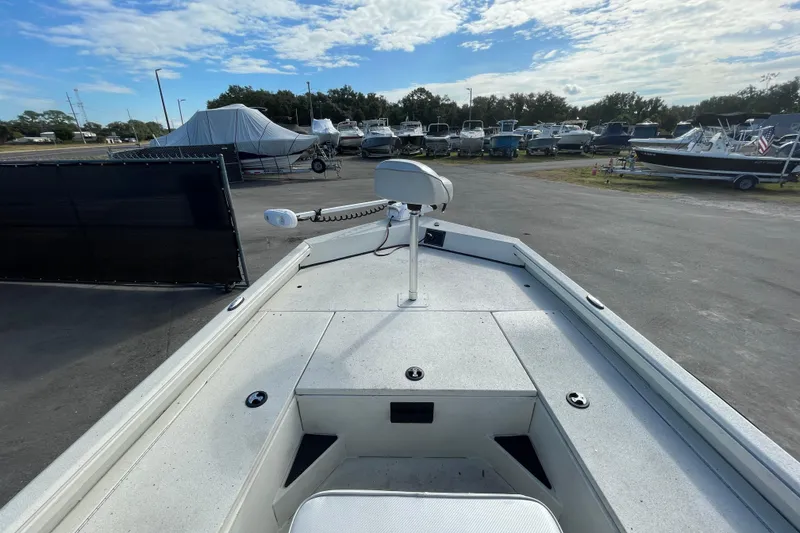 Slide: The Image of 2023 Ranger RB190 boat deck view in a marina with multiple boats. - 29