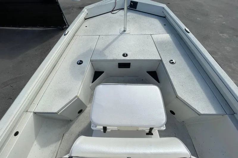 Slide: The Image of 2023 Ranger RB190 boat interior with seating and storage compartments. - 31