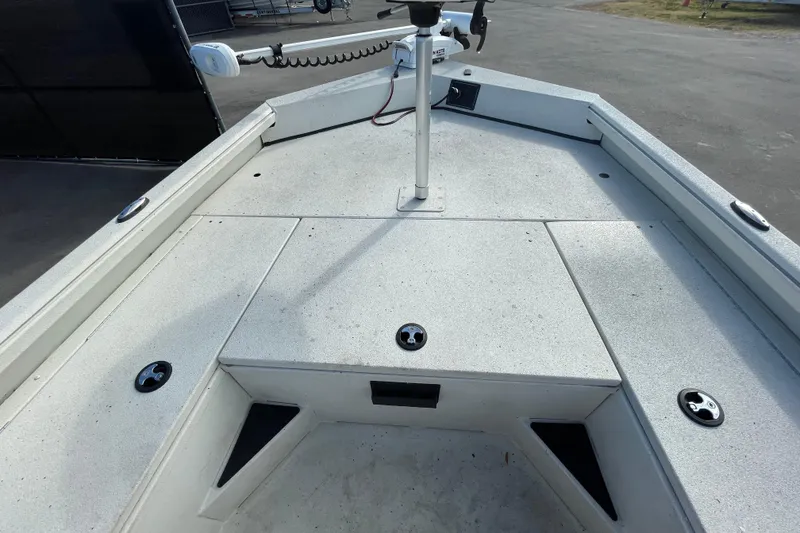 Slide: The Image of 2023 Ranger RB190 boat deck with storage compartments and trolling motor. - 32