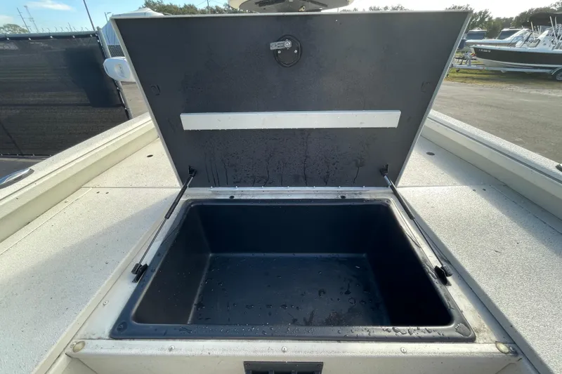 Slide: The Image of Open storage compartment on 2023 Ranger RB190 boat, showing interior space. - 34