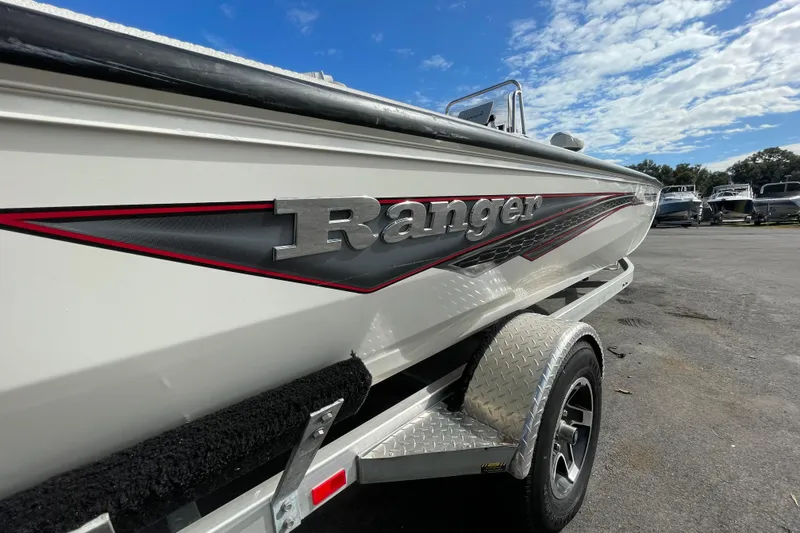 Slide: The Image of 2023 Ranger RB190 boat on trailer under blue sky. - 4