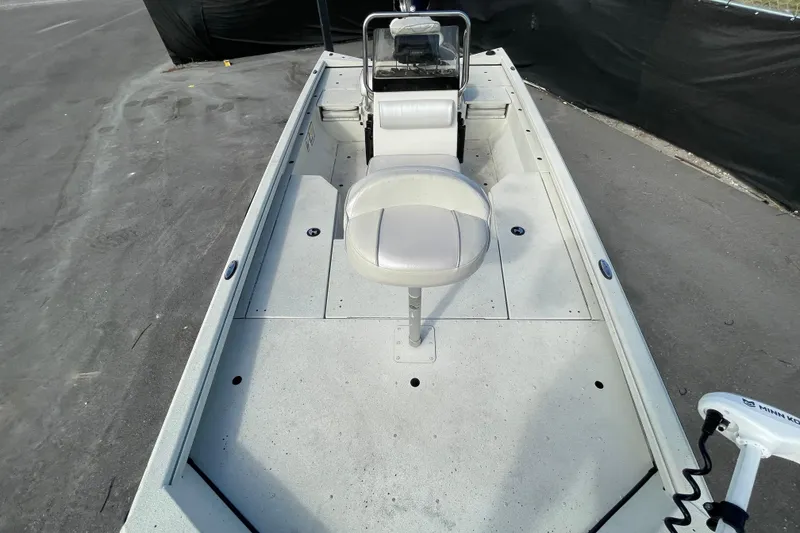 Slide: The Image of 2023 Ranger RB190 boat interior with seating and steering console, viewed from the bow. - 43