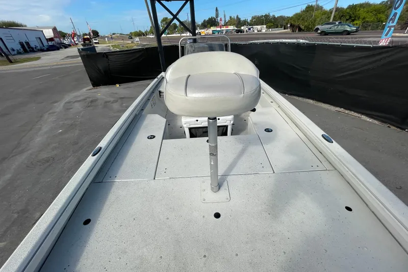 Slide: The Image of 2023 Ranger RB190 boat with elevated seat on deck, parked outdoors. - 44
