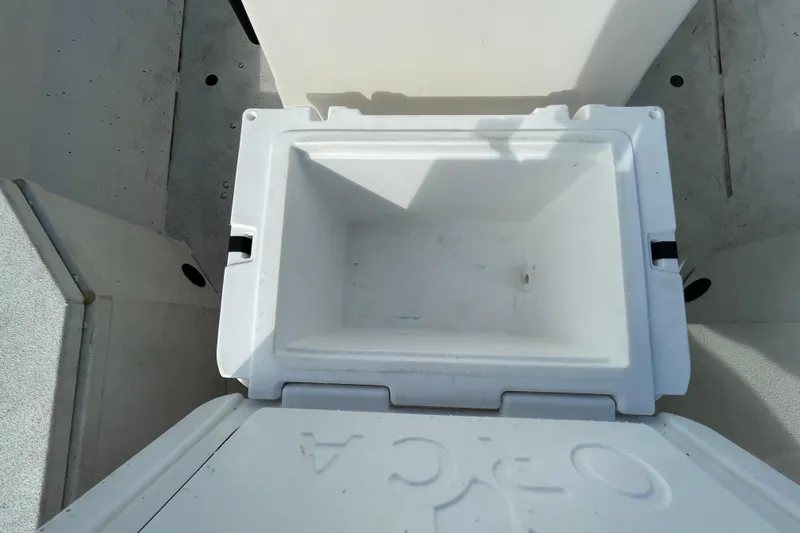 Slide: The Image of Open storage compartment on 2023 Ranger RB190 boat, showing empty interior. - 50