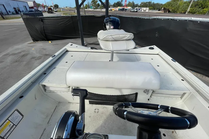 Slide: The Image of 2023 Ranger RB190 boat interior with steering wheel and seating. - 51