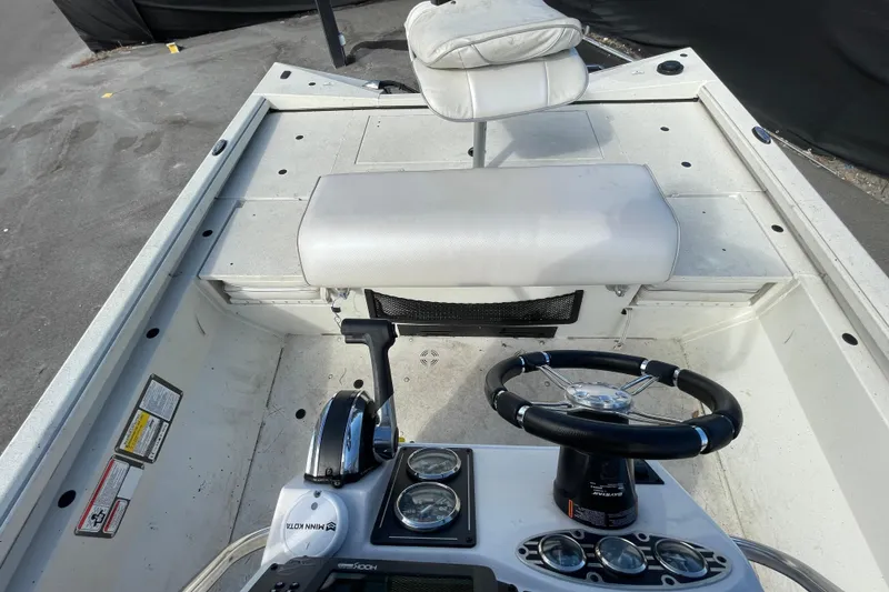 Slide: The Image of 2023 Ranger RB190 boat interior with steering wheel and seating. - 52