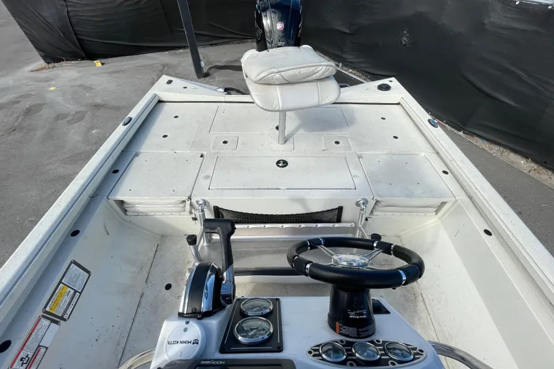 Slide: The Image of 2023 Ranger RB190 boat interior with steering wheel and seating. - 53