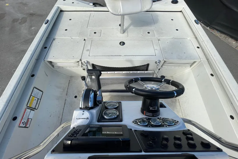 Slide: The Image of 2023 Ranger RB190 boat cockpit with steering wheel and control panel. - 54