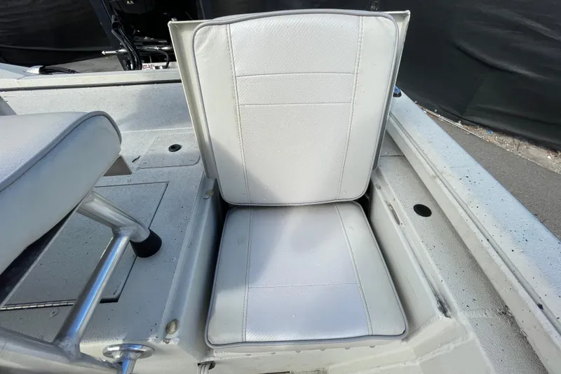 Slide: The Image of 2023 Ranger RB190 boat seat with white upholstery and metal frame. - 56