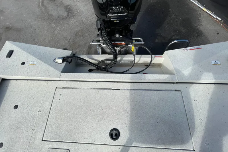 Slide: The Image of 2023 Ranger RB190 boat deck with motor and storage compartment. - 59