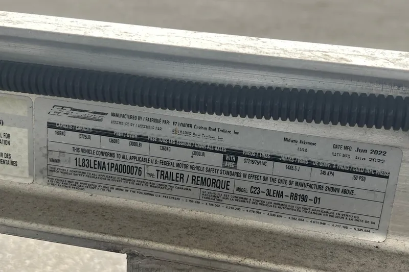 Slide: The Image of Close-up of a trailer compliance label, manufactured June 2022, showing specifications and safety standards. - 61