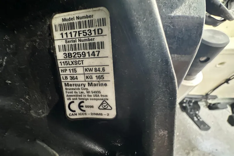 Slide: The Image of Label on Mercury Marine engine showing model and serial numbers, horsepower, and weight details. - 62