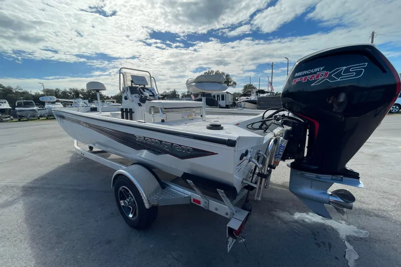 Slide: The Image of 2023 Ranger RB190 boat with Mercury Pro XS engine on trailer, parked outdoors. - 8