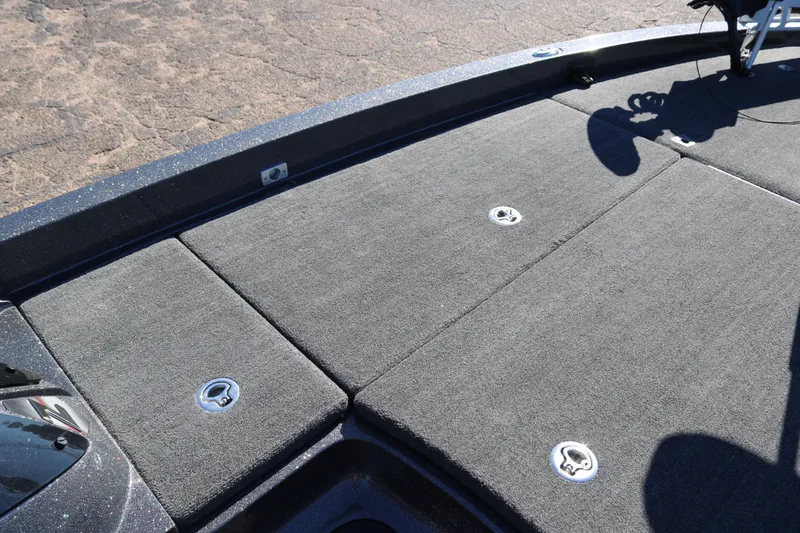 Slide: The Image of 2010 Ranger Z521 Comanche boat deck with carpeted storage compartments. - 14