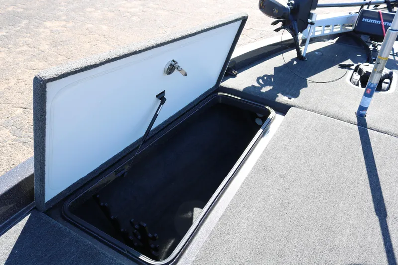 Slide: The Image of Open storage compartment on 2010 Ranger Z521 Comanche boat deck. - 17