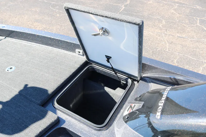 Slide: The Image of Open storage compartment on a 2010 Ranger Z521 Comanche boat deck. - 23