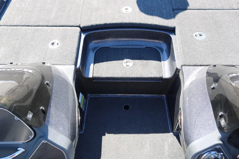 Slide: The Image of 2010 Ranger Z521 Comanche boat deck with storage compartments and sleek design. - 24
