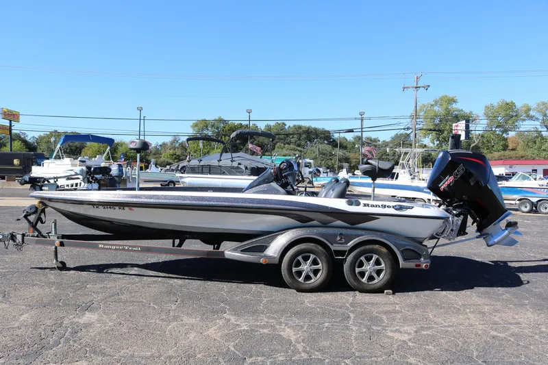 Slide: The Image of 2010 Ranger Z521 Comanche boat on trailer in parking lot, sunny day. - 3