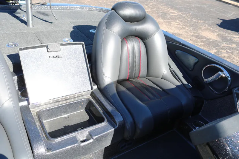 Slide: The Image of 2010 Ranger Z521 Comanche boat interior with black leather seat and storage compartment. - 30