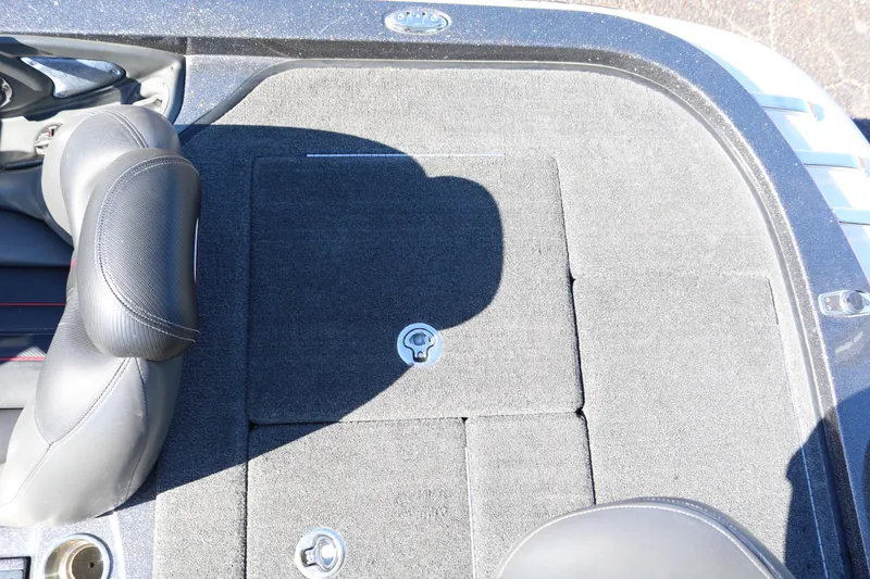 Slide: The Image of 2010 Ranger Z521 Comanche boat interior with carpeted deck and seating. - 35