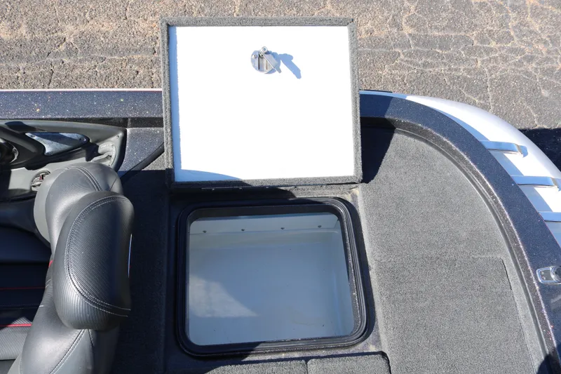 Slide: The Image of 2010 Ranger Z521 Comanche boat storage compartment with open lid and seat detail. - 36